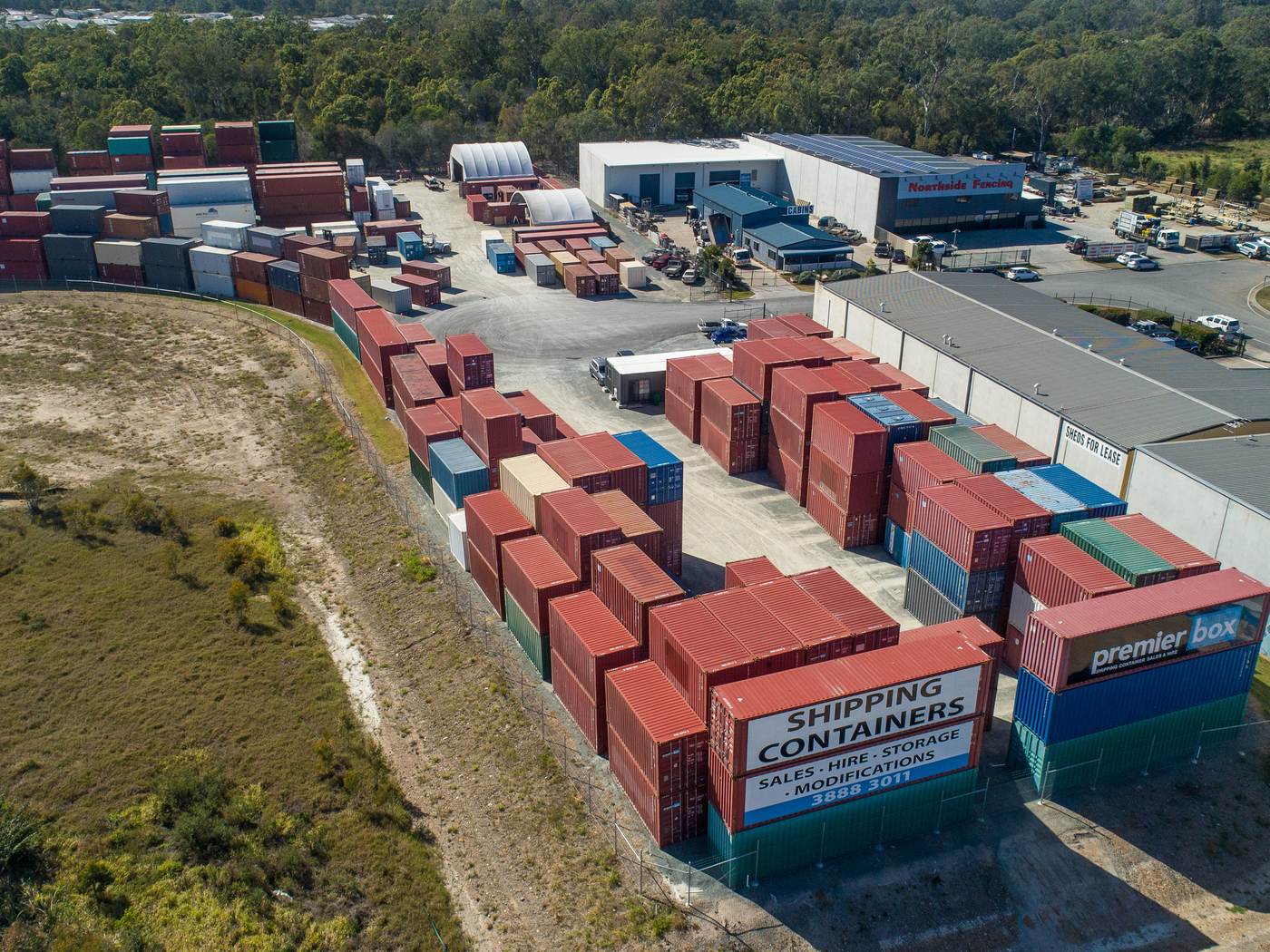 Aerial view of the Burpengary main depot with rows of stacked containers and Premier Box signage