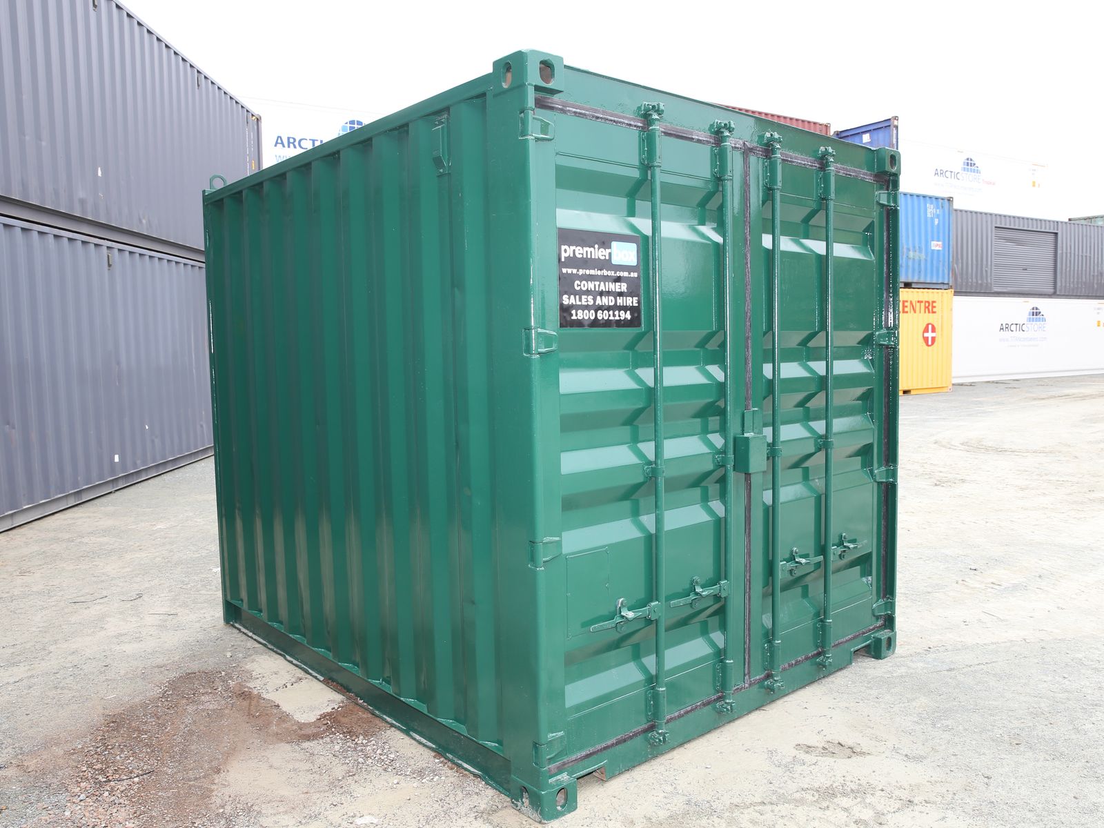 Green 20ft premierbox shipping container, corner view in the yard