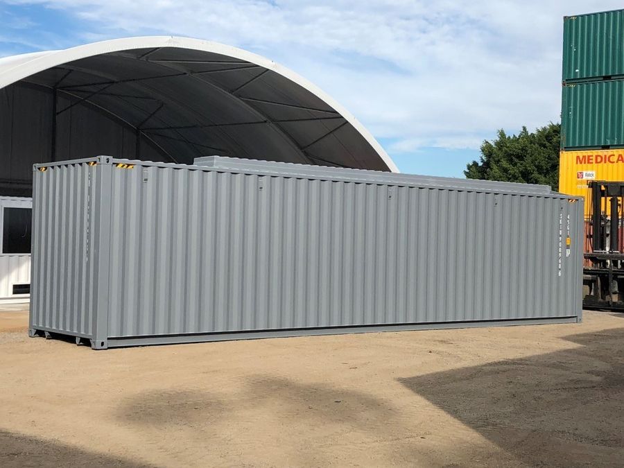 Long grey 40 foot container modified for helicopter storage