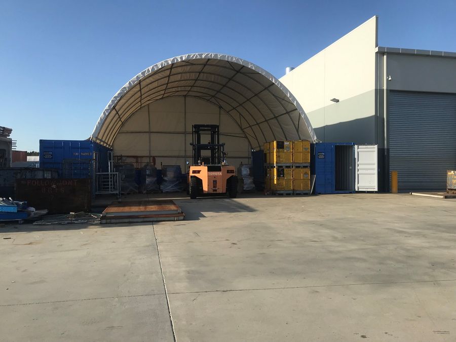 Container workshop and storage conversion under a large dome shelter