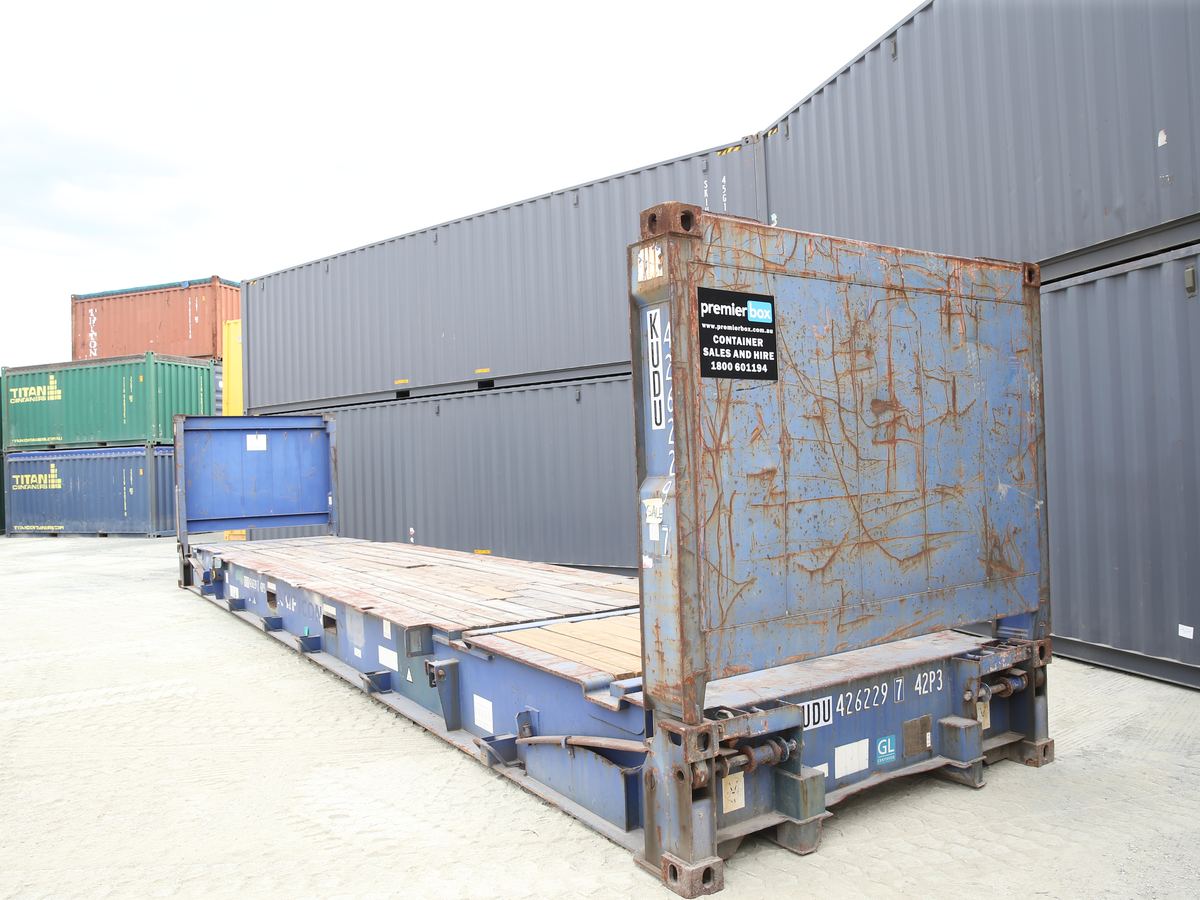 Blue 40ft flat rack container with a raised end wall