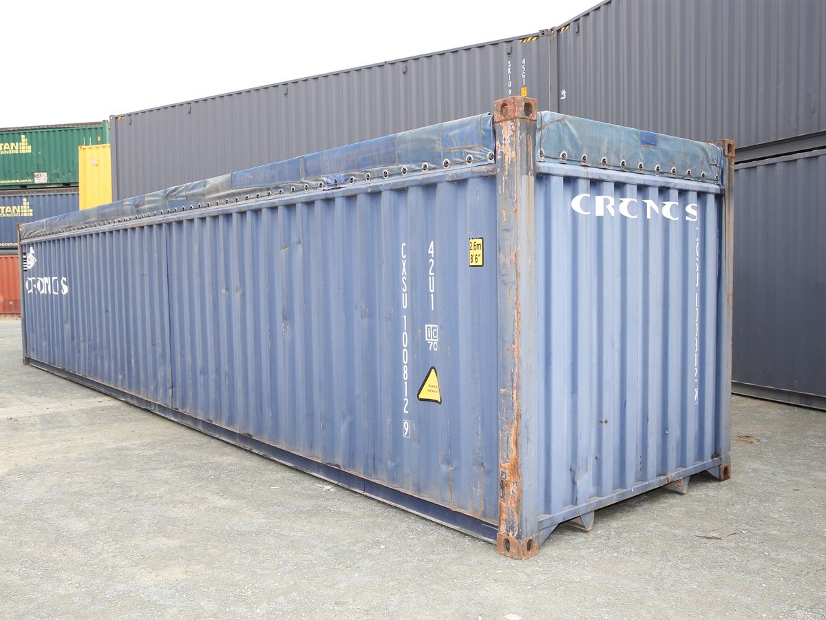 Side view of a blue 40ft open top container with its soft cover fitted