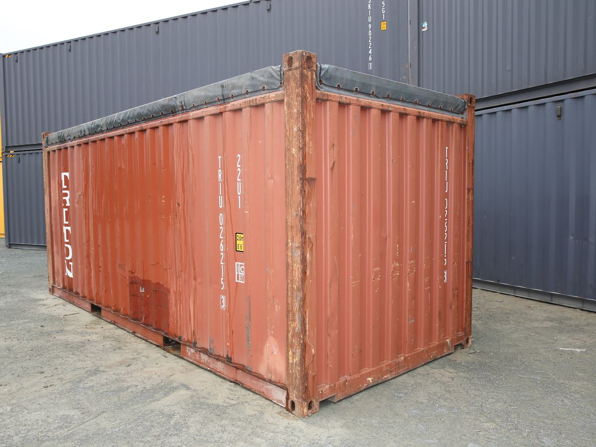 Rust red 20ft open top container with a soft cover