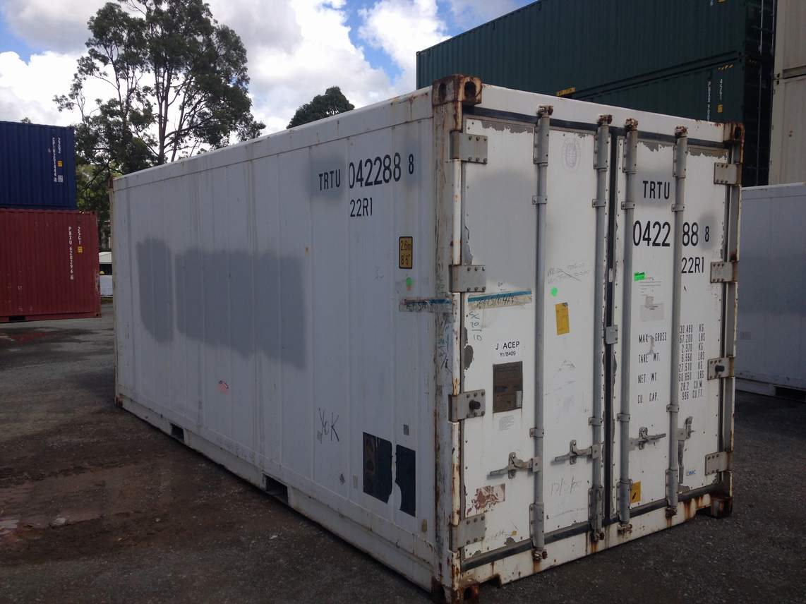Weathered white 20ft refrigerated container, door end, in the depot yard