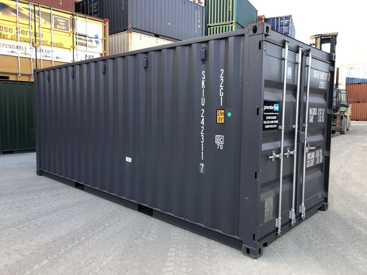 Side view of a charcoal 20ft hire container in the depot yard