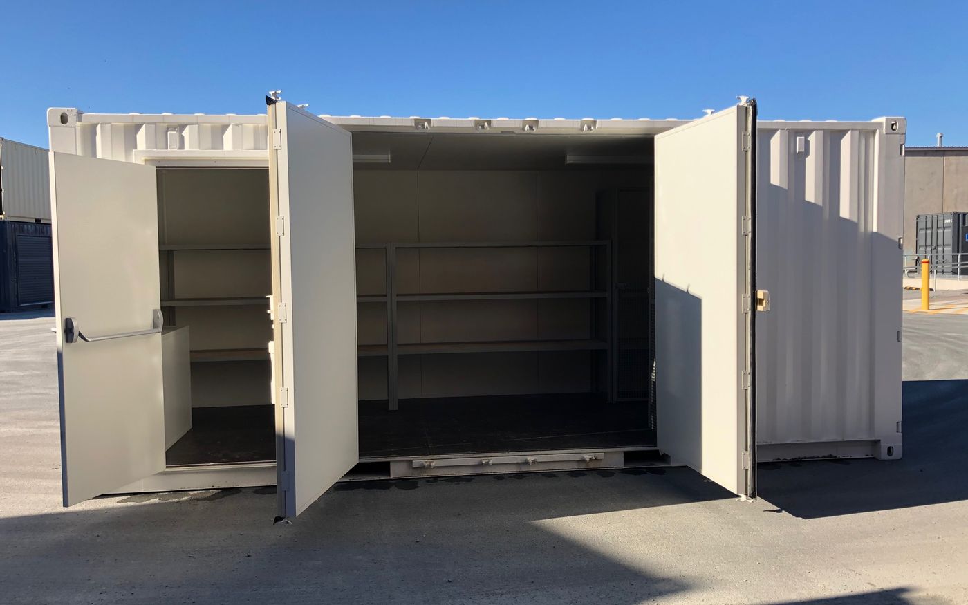 Cream 20ft container with doors open showing custom internal shelving