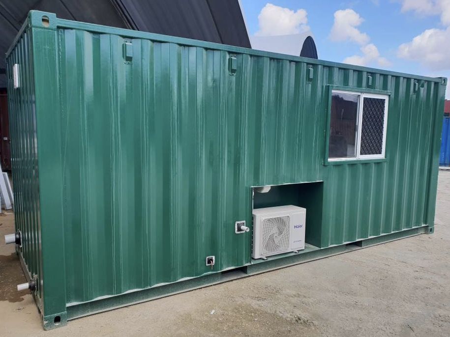 Green 20ft container with a window and air conditioner