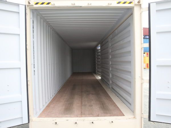 Clean white interior of a 40ft container with a timber floor