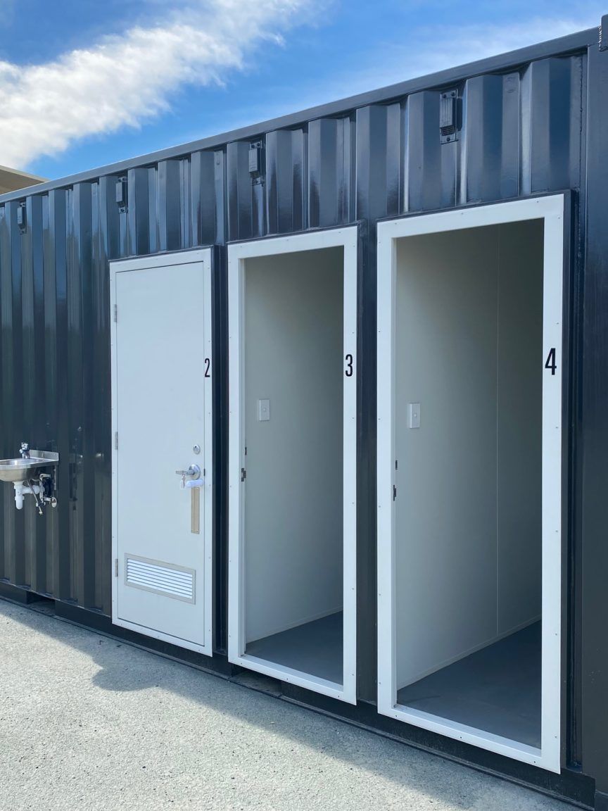 Modified shipping container with side opening doors