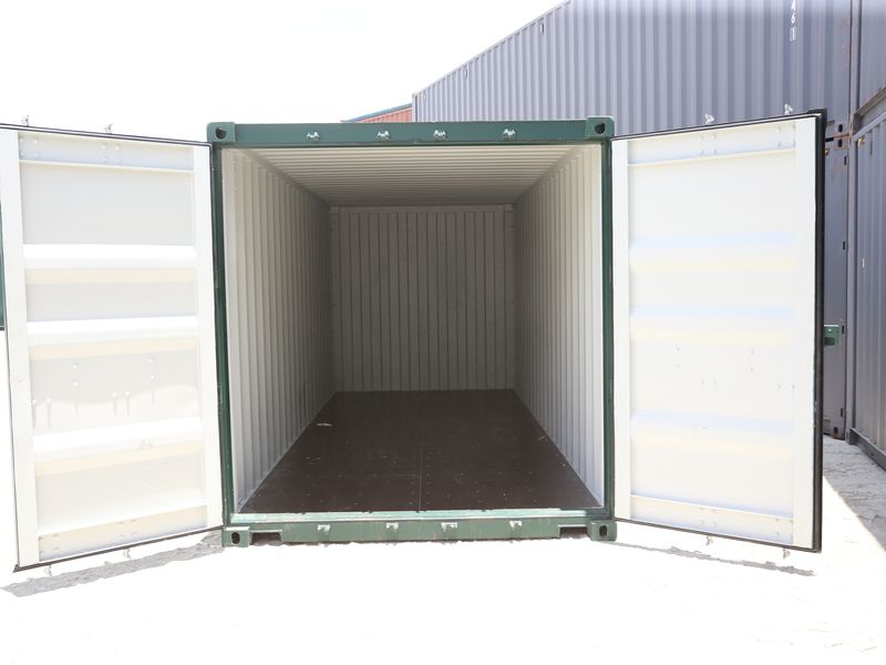 Interior of a green 20ft container with both doors open